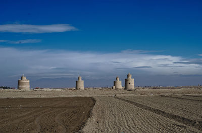 Built structure on land against sky