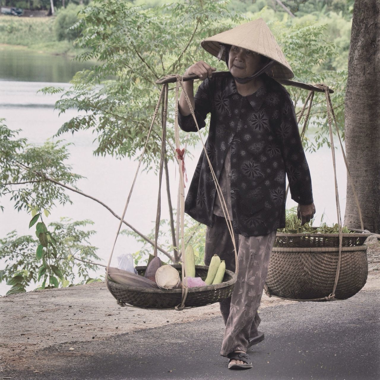 full length, lifestyles, tree, leisure activity, rear view, casual clothing, men, standing, walking, sunlight, person, day, outdoors, holding, street, built structure, umbrella, building exterior