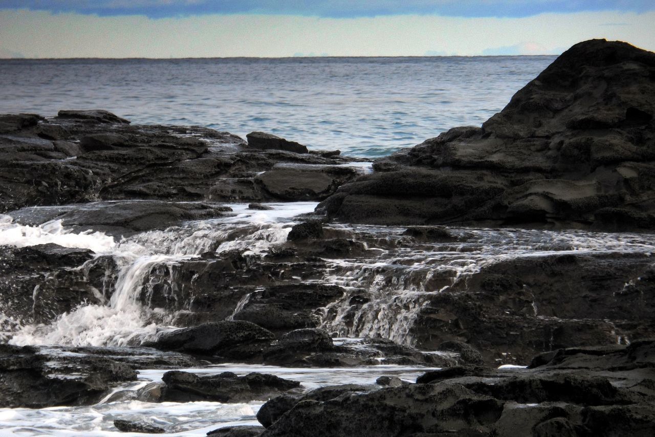 water, sea, rock - object, scenics, rock formation, beauty in nature, nature, tranquil scene, rock, tranquility, wave, surf, motion, sky, idyllic, horizon over water, cliff, shore, outdoors, no people