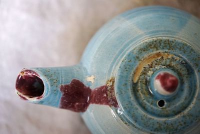 Directly above shot of ceramic kettle on table