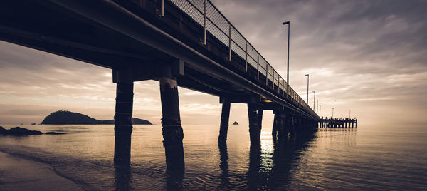 View of bridge over calm sea