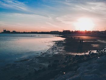 Scenic view of river against sky during sunset