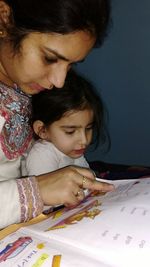 Close-up of mother and daughter
