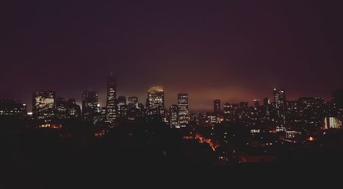 Illuminated cityscape at night