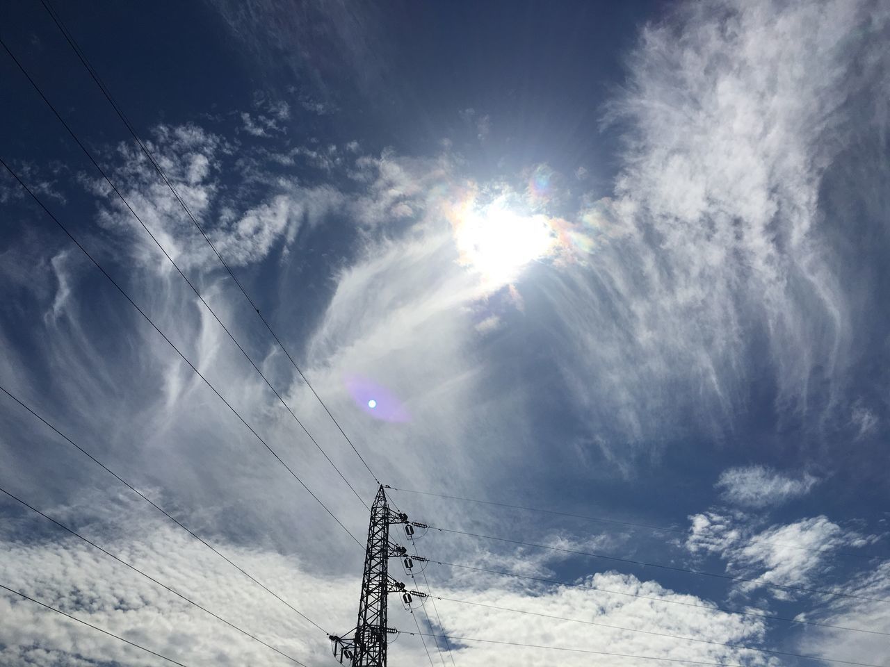 LOW ANGLE VIEW OF VAPOR TRAILS AGAINST SKY