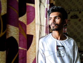 Portrait of young man looking away