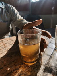 Close-up of beer glass on table