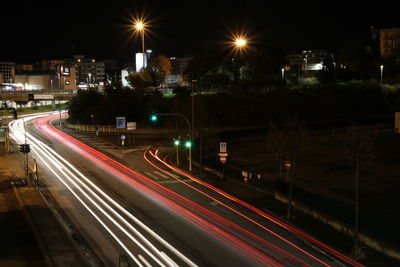 High angle view of light trails on road at night