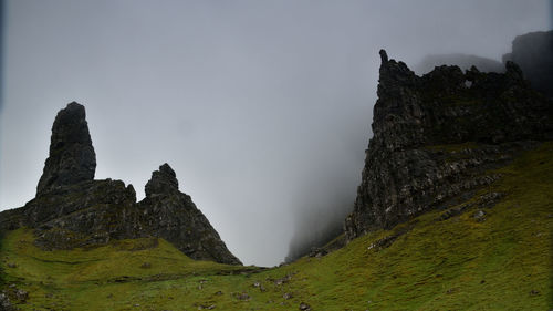 Scenic view of rock formations against sky