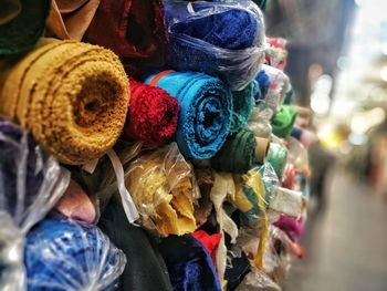 Close-up of rolled textiles for sale in store