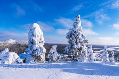 Panoramic view of snow covered landscape against sky