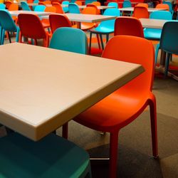 Empty chairs and table in restaurant