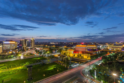 High angle view of illuminated buildings in city at night