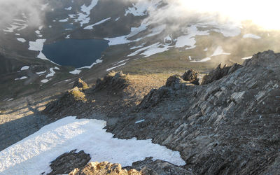 Aerial view of snowcapped mountains against sky