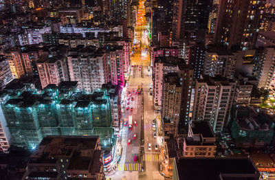 Aerial view of illuminated buildings in city at night