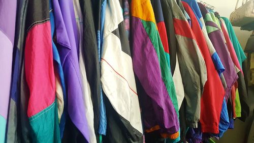 Close-up of multi colored clothes hanging on display at store