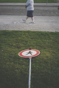 People playing soccer on grass