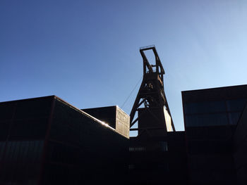 Low angle view of built structure against clear blue sky