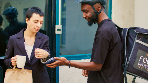 Portrait of young man using mobile phone