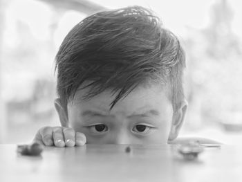 Close-up of boy playing with bricks