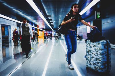 People walking on railroad station