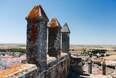 Old ruins of building against clear blue sky