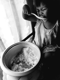 Full length of girl in bowl on table