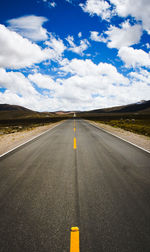 Empty road against sky