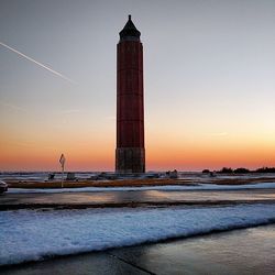 Silhouette of tower at sunset