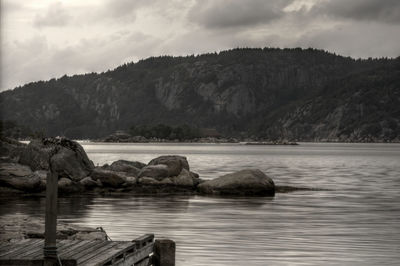 Scenic view of sea against cloudy sky