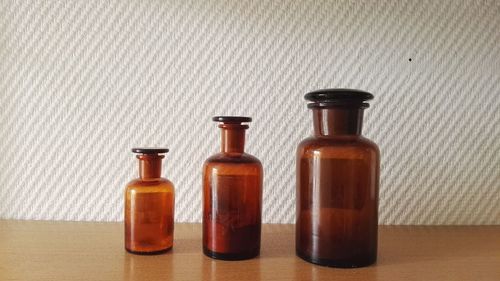 Close-up of wine bottles on table