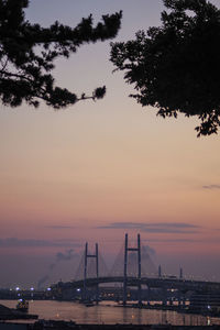 View of suspension bridge against sky during sunset