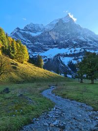 Scenic view of snowcapped mountains against sky