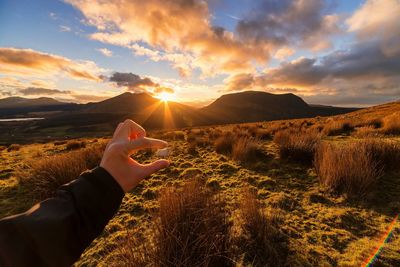 Scenic view of landscape against sky during sunset