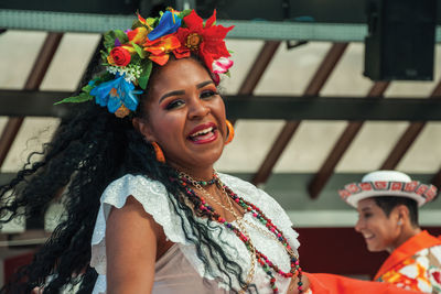 Portrait of a smiling young woman looking away