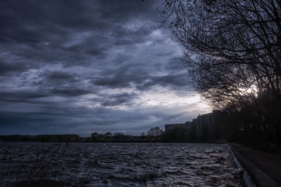 Scenic view of land against sky at dusk