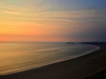 Scenic view of sea at sunset