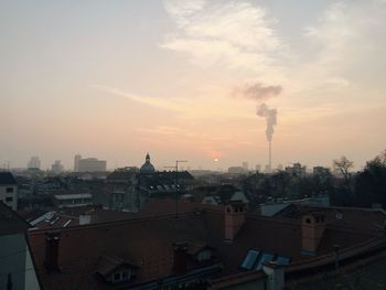 Cityscape against sky during sunset