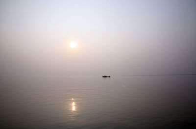 Scenic view of calm sea at sunset