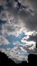 Low angle view of building against cloudy sky