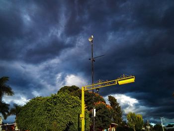 Low angle view of street light against sky
