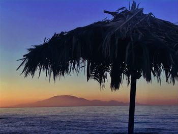 Scenic view of sea against sky at sunset