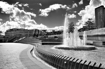 View of buildings against cloudy sky