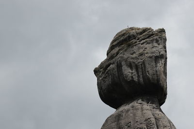 Low angle view of statue against sky