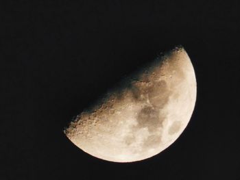 Low angle view of moon against clear sky at night
