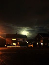 Illuminated building against sky at night