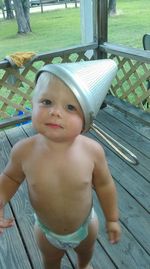 Portrait of cute baby girl sitting on chair