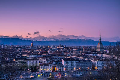 High angle view of city at sunset