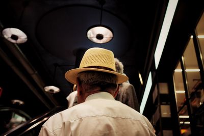 Rear view of man in bus