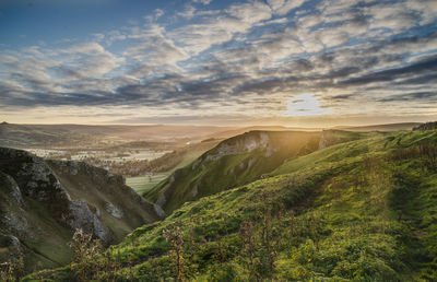 Scenic view of landscape against sky during sunset